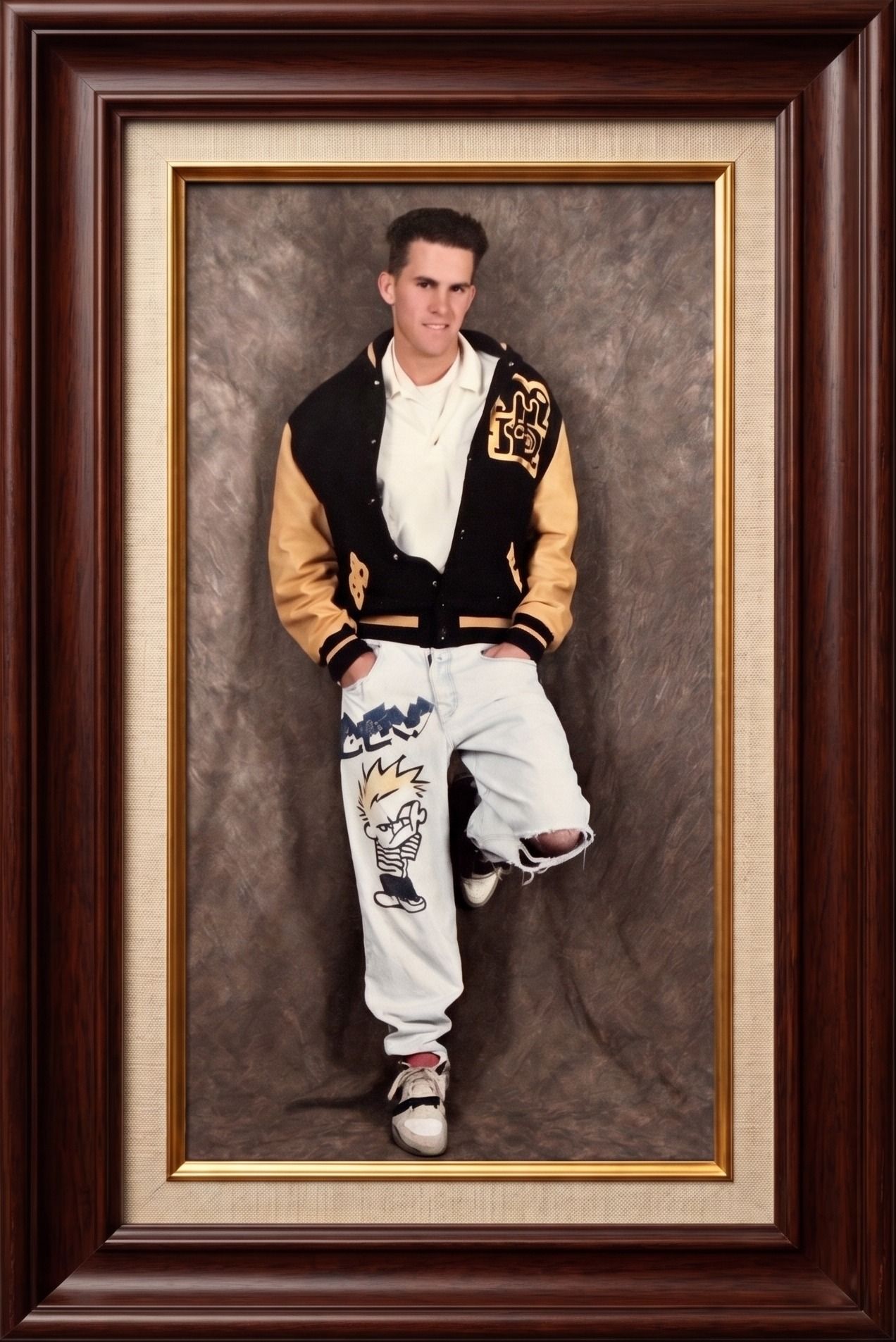 Drew in the early nineties: letterman jacket, hand-painted jeans, high-top sneakers, in a dark wood and gold frame